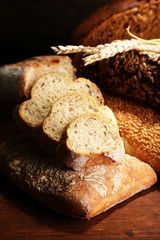 Much bread on wooden board