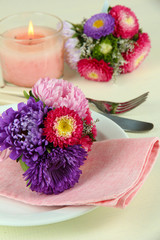 Festive dining table setting with flowers