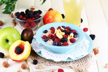 Oatmeal in plate with berries