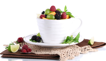Fruit salad in cup on napkin isolated on white