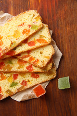 Biscotti with candied fruits, on wooden background