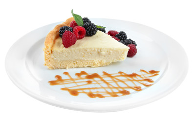 Slice of cheesecake  with berries and sauce
