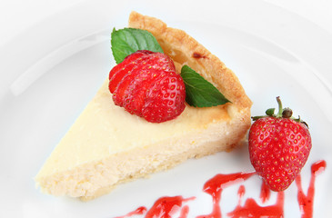 Slice of cheesecake with  strawberry and sauce