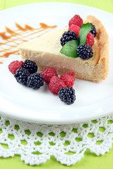 Slice of cheesecake with raspberry and blackberry