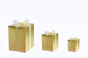three golden gift box on wi\hite background