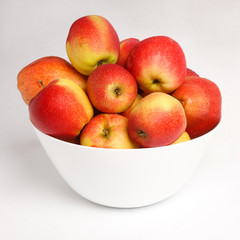 red apples in a white bowl