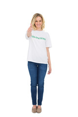 Fototapeta premium Happy blonde volunteer giving thumb up to camera