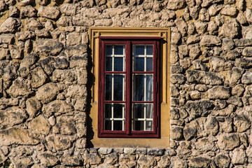 Fototapeta na wymiar Stone Castle wall with Gothic Red Castle Window - Lednice