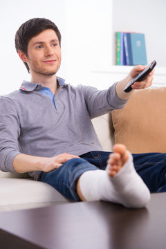 Man watching TV in bandage