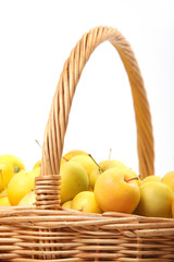 yellow apples in a wicker basket