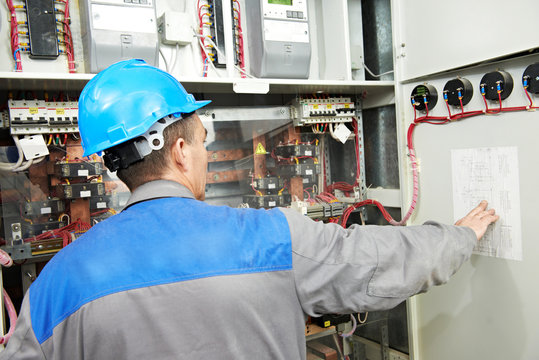 Electrician working at power line box