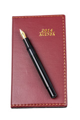 Leather notebook and pen isolated