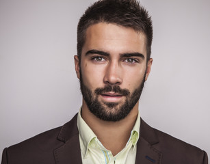 Elegant young handsome man. Studio fashion portrait.