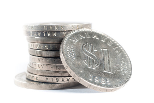 Old Malaysia Coin stacked on a white background