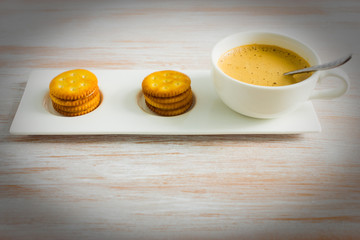Fresh coffee in cup with cookie