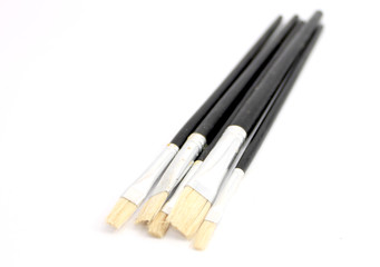 Wooden paint brush over white background