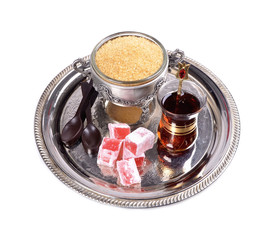 Turkish tea in a glass cup on a tray,Turkish delight