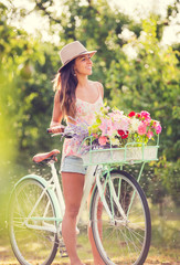 Beautiful young woman on bike