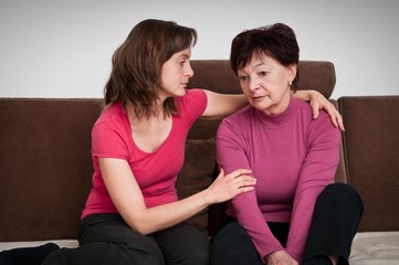 Big problems - daughter comforts senior mother