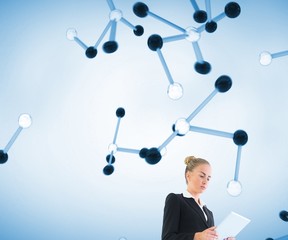 Blonde businesswoman holding new tablet
