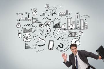 Happy businessman holding a briefcase and running
