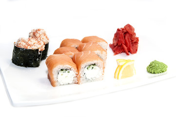 Japanese rolls in a restaurant with fish and vegetables