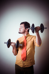 Fototapeta na wymiar funny crazy young man weightlifting