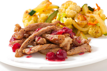 Beef stroganoff with cranberry sauce and grilled vegetables