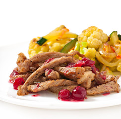 Beef stroganoff with cranberry sauce and grilled vegetables