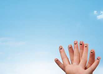 Happy smiley fingers looking at clear blue sky copyspace