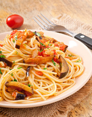 spaghetti with fried eggplant and tomatoes and sweet 