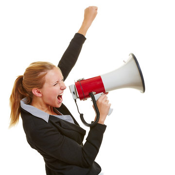 Business woman with megaphone and clenched fist