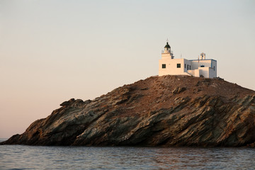 Fototapeta na wymiar lighthouse on rocky island