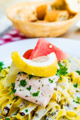 close-up of plate of pasta and smoked salmon