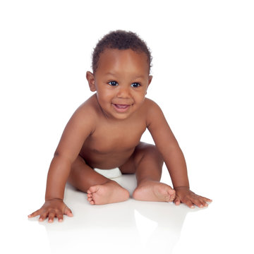 Adorable african baby in diaper sitting on the floor