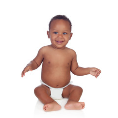 Adorable african baby in diaper sitting on the floor