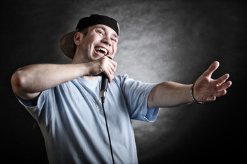 Rap singer man with microphone cool hand gesture