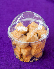 Baked raw rusks in a wooden table.