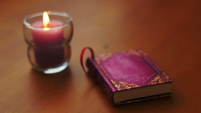Romantic Book and Candle Rack Focus