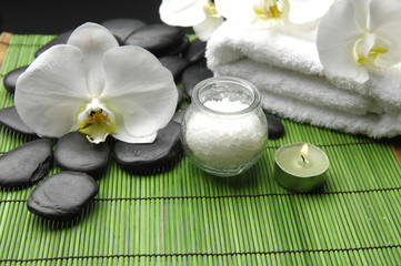 Fototapeta na wymiar Orchid ,candle ,salt in bowl and stones