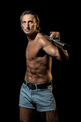 Fototapeta na wymiar Bodybuilder Exercising Isolated On Black Background