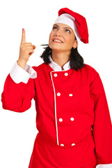 Chef woman pointing up