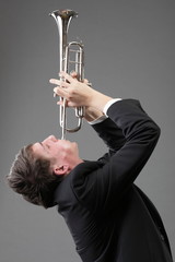 Portrait of a young man playing his Trumpet