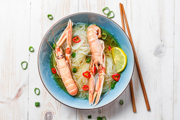 Traditional Thai soup with scampi