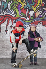 Skater boy with a little girl