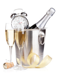 Christmas champagne with alarm clock in bucket