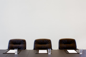 The boardroom table is set for the Annual General Meeting