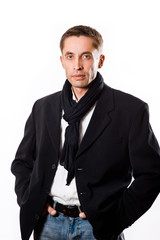 Portrait of attractive successful business man in black coat