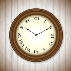 vintage clock on wooden background