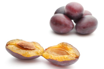Fresh and natural plums on a white background